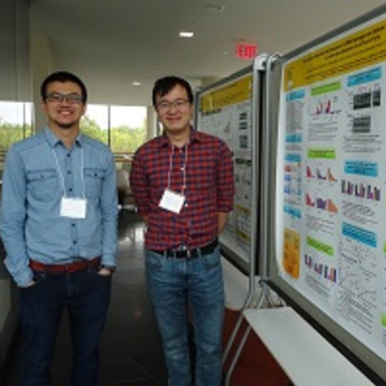 Panithi Saktrakulkla and Visarut Buransudja during a poster session.